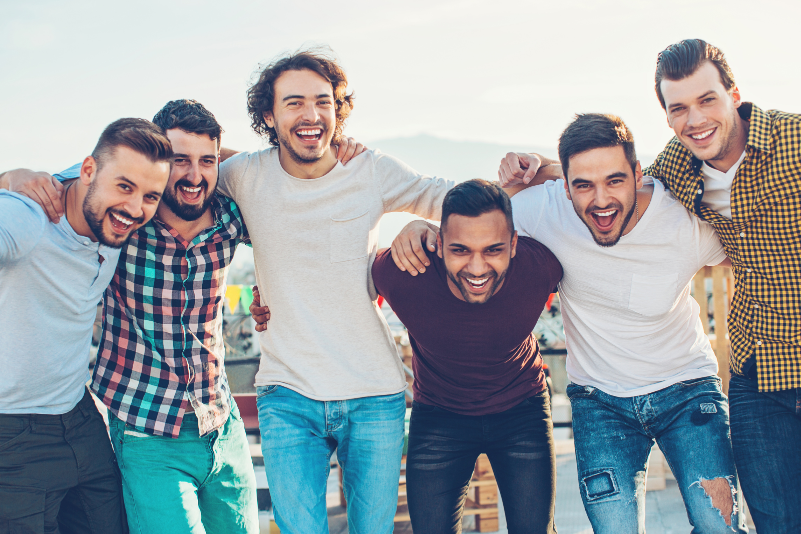 group of smiling men after completing addiction treatment at hand in hand recovery in marietta