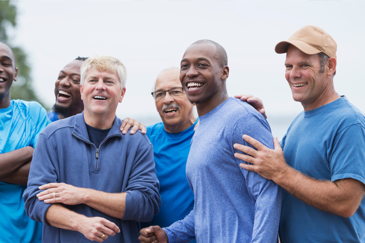 group of men standing together after going over the details of How Long is an Intensive Outpatient Program?