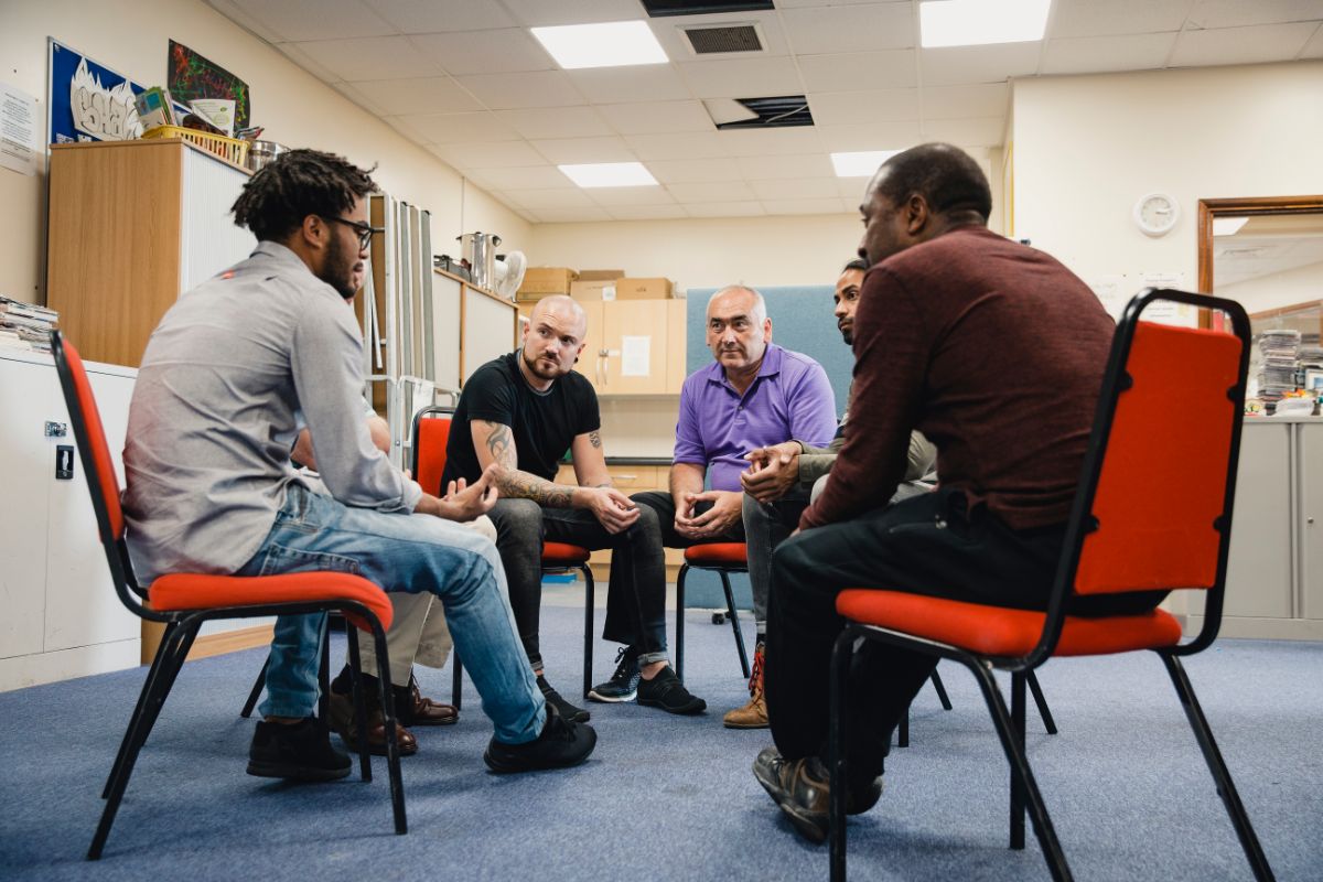 men in peer support during aftercare program in Georgia