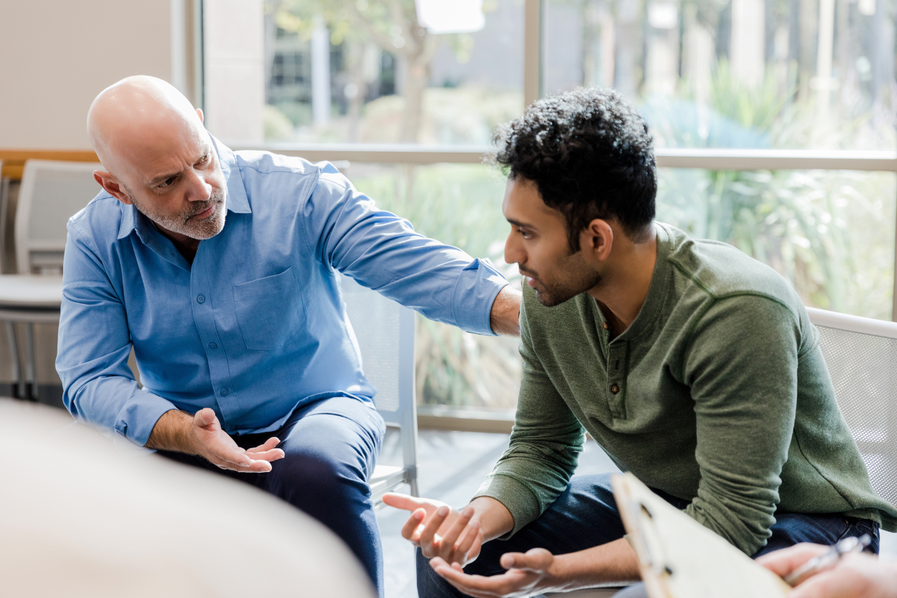 man sitting in therapy asking his therapist can you drink alcohol while taking prednisone?