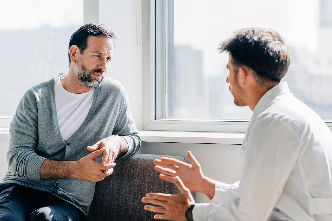 therapist speaking with patient on how much does sober living cost?